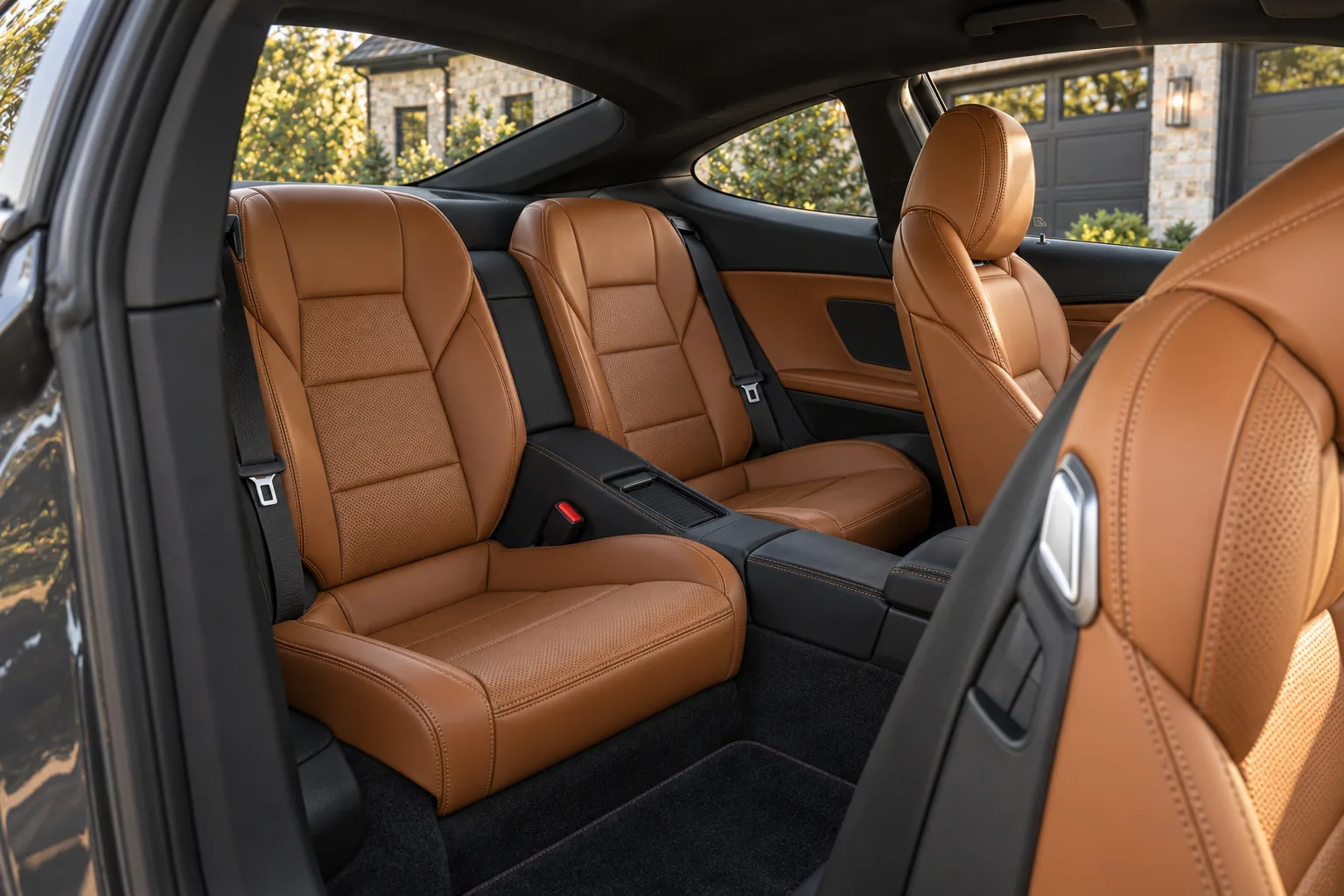 Compact cognac rear seating in the graphite grand touring coupe